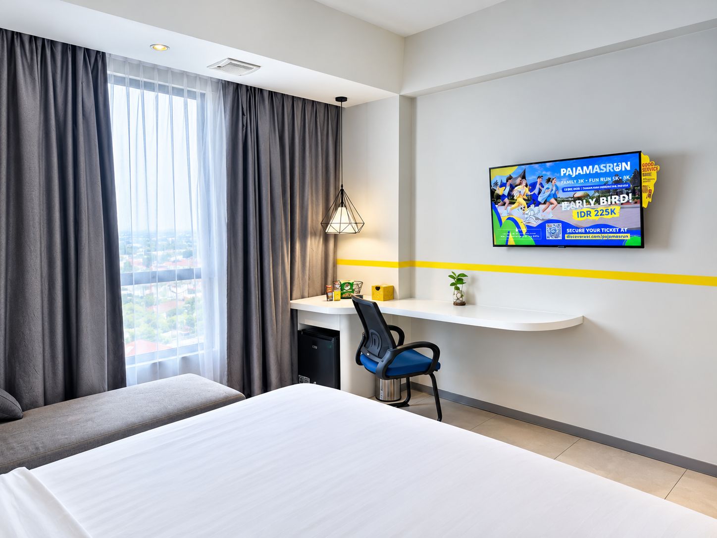 A hotel room with a bed, a desk, a chair, a television, and a window with curtains.