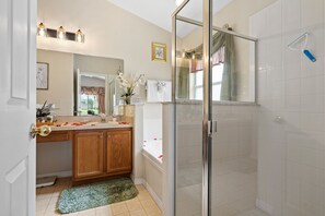 Bathtub, hair dryer, towels, soap