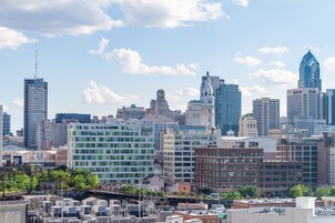 A city skyline with various buildings, including a mix of modern and historic architecture.