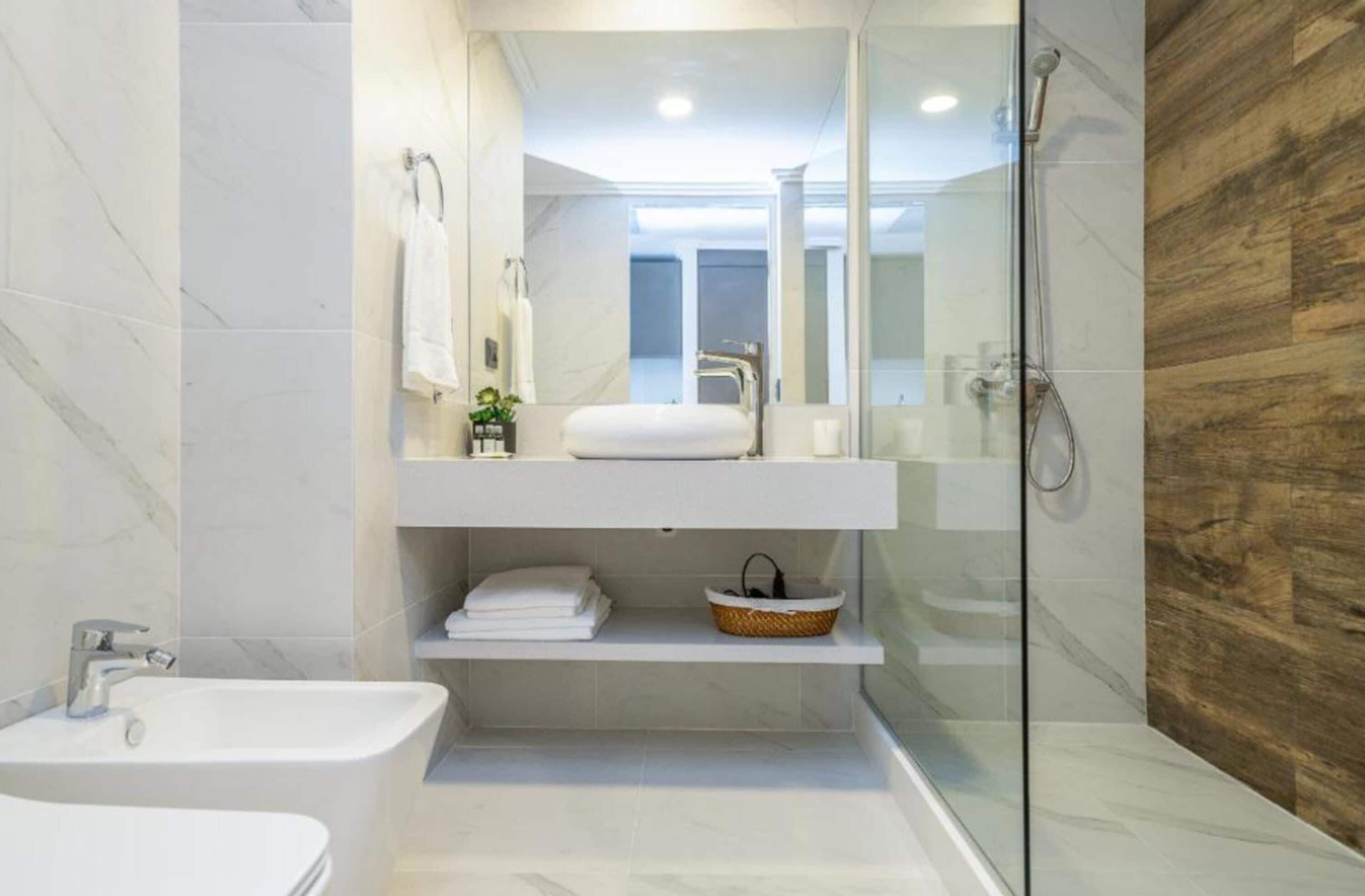 family suite | bathroom | shower, rainfall showerhead, free toiletries, hair dryer