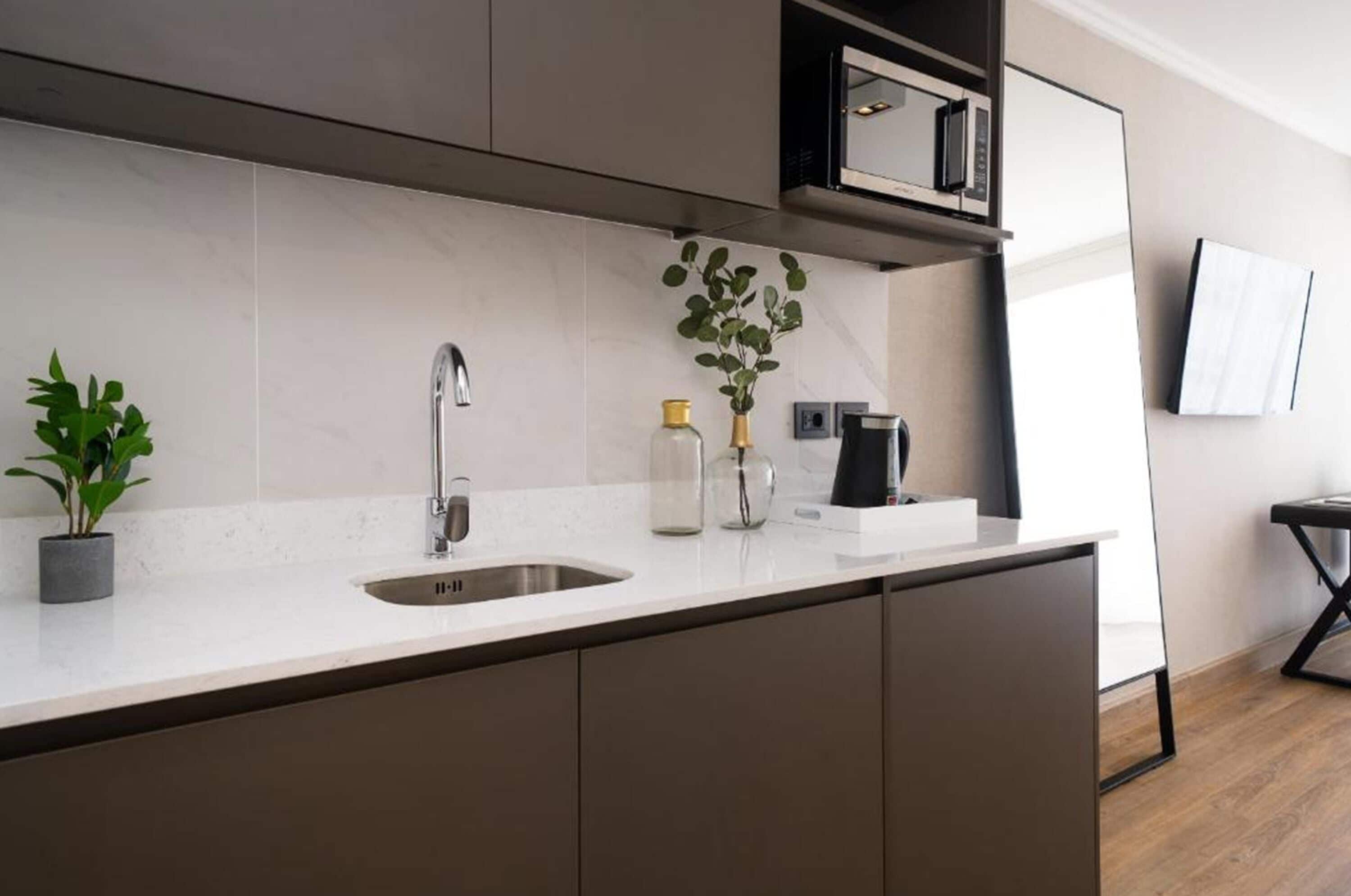 mini-fridge, microwave, coffee/tea maker, electric kettle