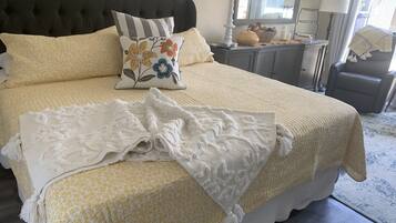 1 bedroom, desk, iron/ironing board, travel crib