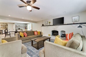 Smart TV, fireplace, foosball, books