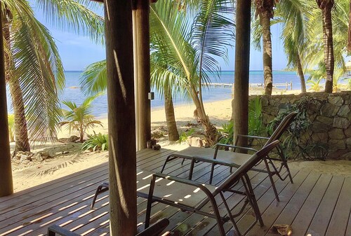 Beachfront home with pristine, calm waters, white sands and unbelievable sunset