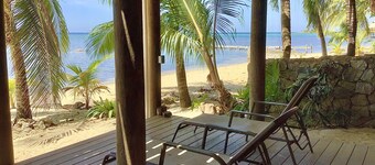 Beachfront home with pristine, calm waters, white sands and unbelievable sunset