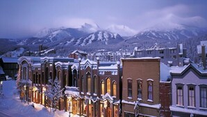 A snow-covered town with historic buildings and a mountain backdrop. - Brecken Haus (Breckenridge)