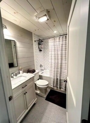Bathtub, hair dryer, towels