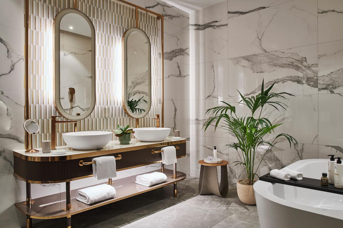 presidential suite | bathroom | designer toiletries, hair dryer, bathrobes, slippers