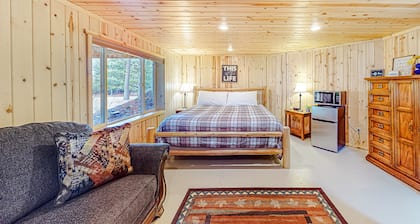 Riverfront cabin with large yard, great deck, & fireplace