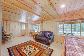 TV, fireplace - Riverfront cabin with large yard, great deck, & fireplace (Joseph)