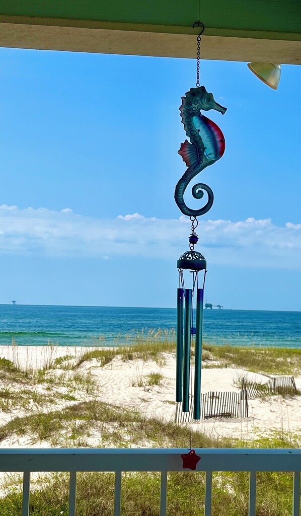 A seahorse wind chime hanging from a balcony overlooking a beach. - Beachfront/GulfFront,1stRow,5BR,2500sf,sleeps18,HugePorch,Renovated &PetFriendly (Gulf Shores)