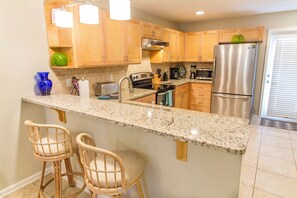 Fridge, microwave, oven, stovetop - Avery's Ocean Breeze by Distinctive Beach Rentals (St. Augustine)