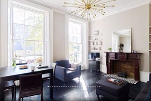 TV, fireplace, books