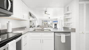 Condo, Multiple Beds, Garden View (#J24 - No Pets) | Private kitchen | Fridge, microwave, stovetop, dishwasher