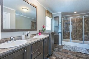 Combined shower/bathtub, hair dryer, towels, soap