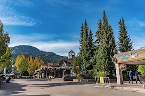 A mountain town with a central building featuring shops, a day lodge, and rentals & storage.