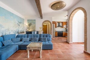 TV, fireplace - Cortijo La Alberquilla – Andalusian Charm with Mountain and Sea Views, Pool, Wi-Fi, and Garden (OTIVAR)