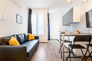 Living area - GuestHost - The apartment is located on the ground floor of a building.It comfortably accommodates 3 people in 40 square meters of space, with a double bedroom and a french sofa bed in the living room.The apartment is located a few minutes on foot from F (Bologna)