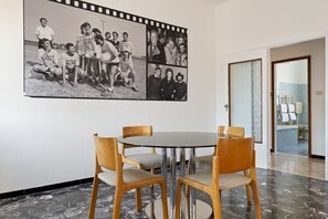 Dining - GuestHost - The apartment is located on the fourth floor of a building with a lift, not suitable for the disabled.It comfortably accommodates six people in 102 square meters of space, with a double bed, two single beds and a sofa bed in the living room.C (Bologna)