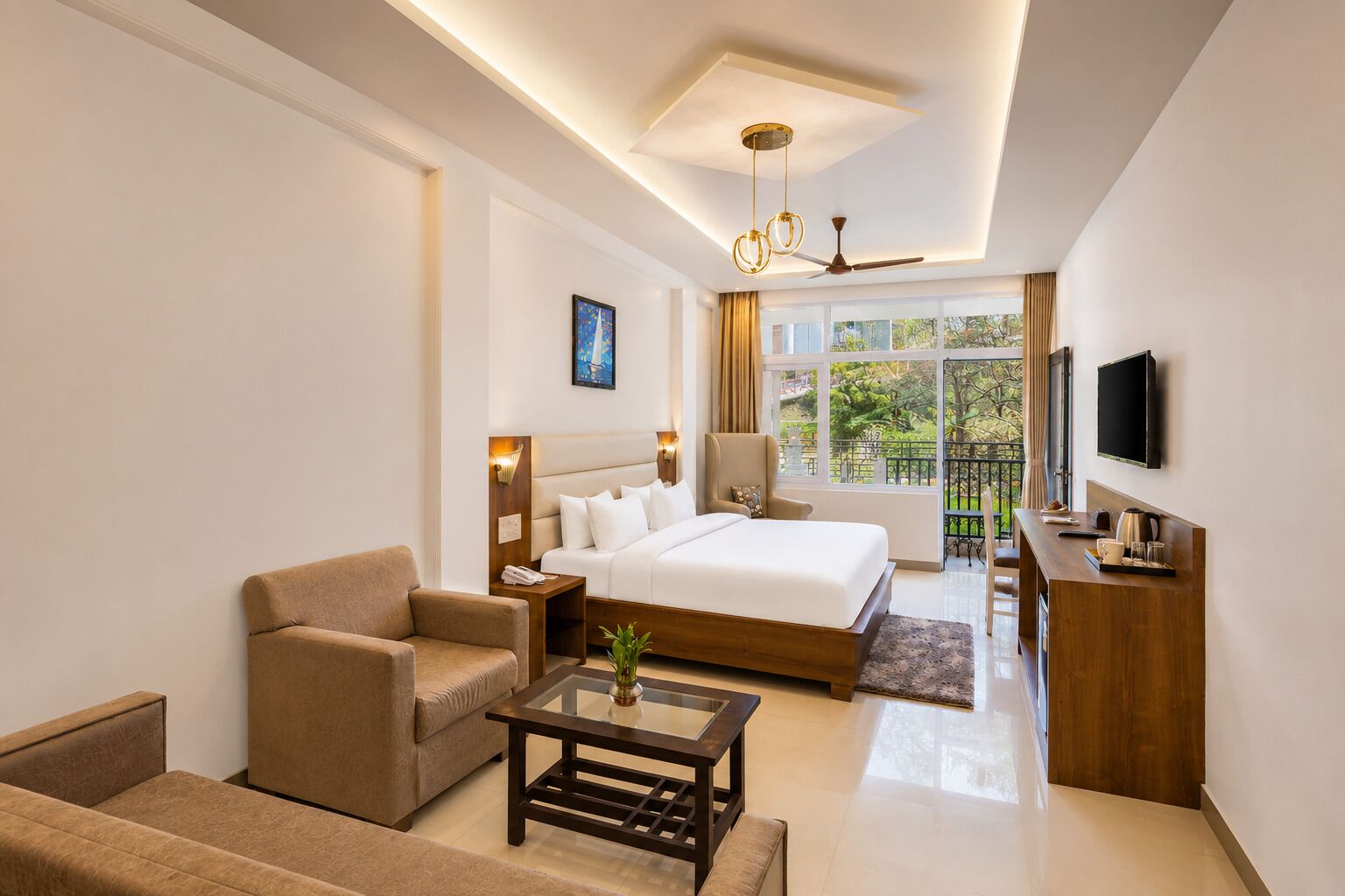 A hotel room with a bed, a sofa, a coffee table, a desk, and a TV.