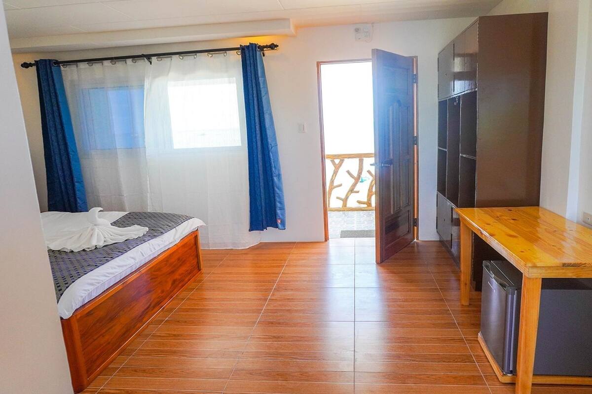 Habitación Deluxe doble | Camas supletorias y ropa de cama