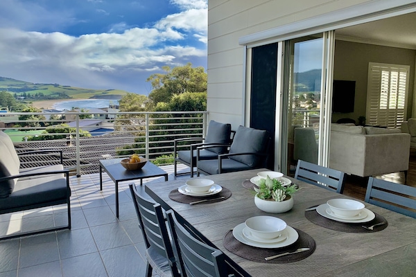 Relax and dine on the balcony with mountain and sea views