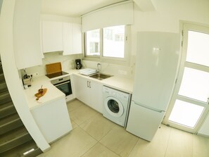 Microwave, dishwasher, coffee/tea maker, cookware/dishes/utensils