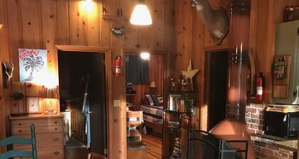 Quaint two bedroom cabin just a few steps away from and on Mountain Rest Lake.