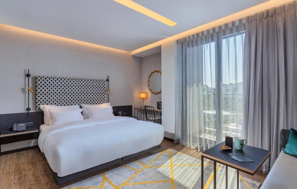 Deluxe Double Room, Balcony | Desk, blackout drapes, free cribs/infant beds, bed sheets