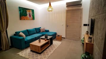 Apartment | Living room | 30-inch TV with digital channels