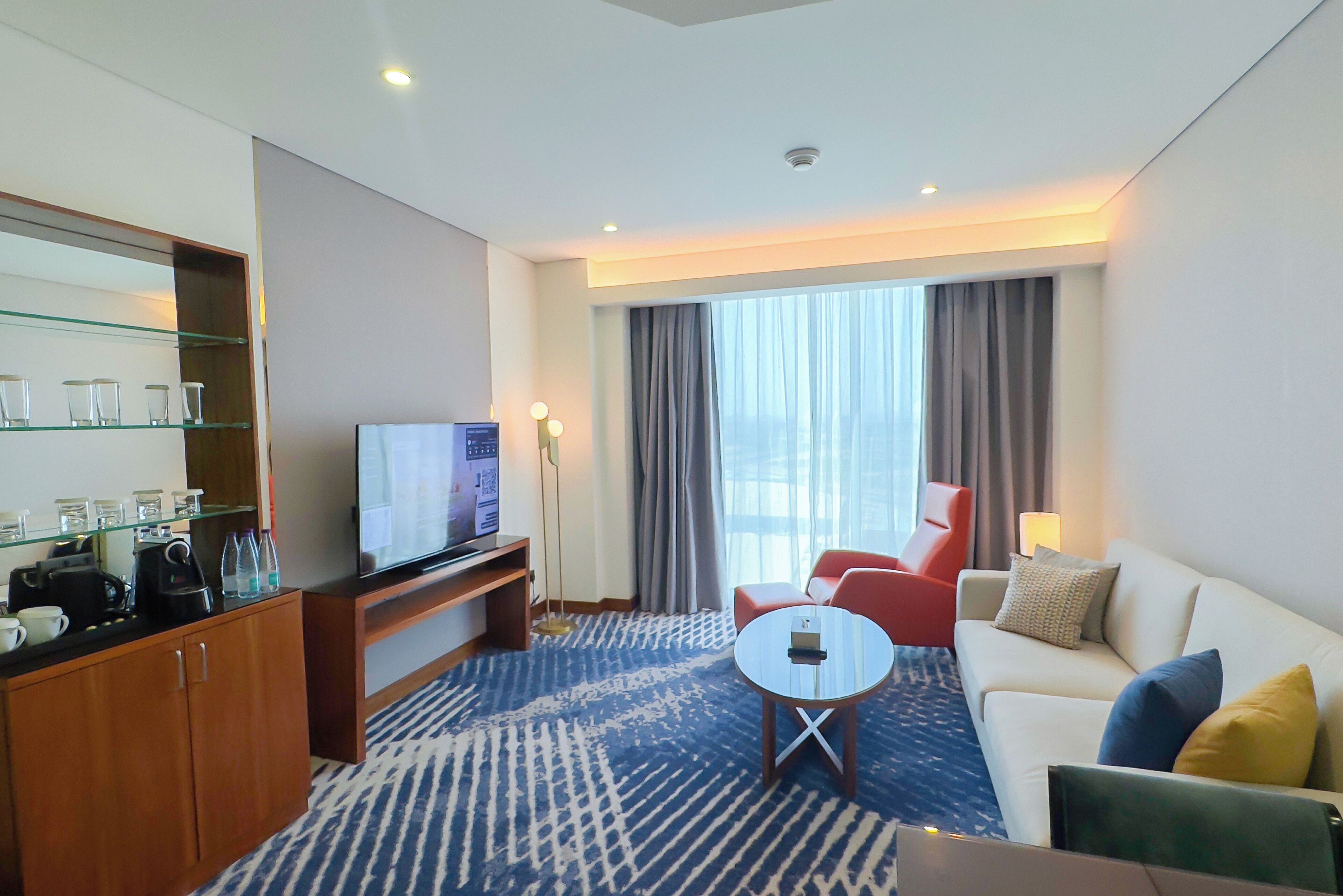 premium suite, 3 bedrooms | living area | 55-inch flat-screen tv with satellite channels, tv