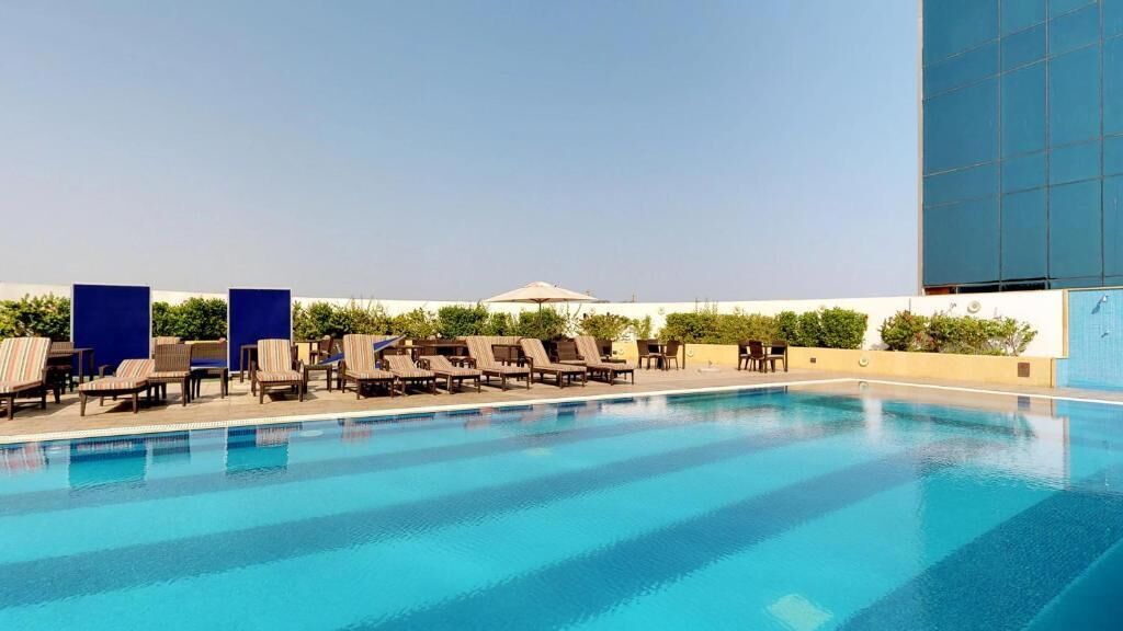 outdoor pool, pool umbrellas, pool loungers