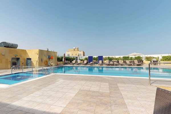 Outdoor pool, pool umbrellas, pool loungers