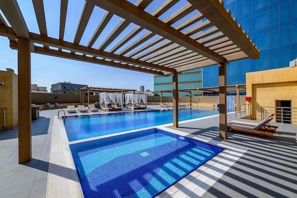 Outdoor pool, pool umbrellas, sun loungers