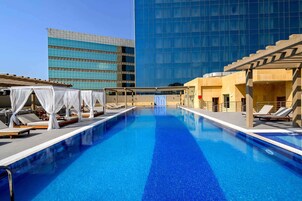 Outdoor pool, pool umbrellas, pool loungers