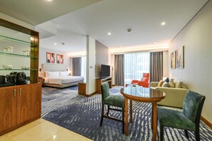 Junior Suite, 1 King Bed (Premium) | Living area | 55-inch flat-screen TV with satellite channels, TV