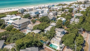 A coastal residential area with houses, a beach, and a swimming pool. - Periwinkle - Sunrise Beach on 30A, Heated Private Pool, Free Beach Service! (Santa Rosa Beach)
