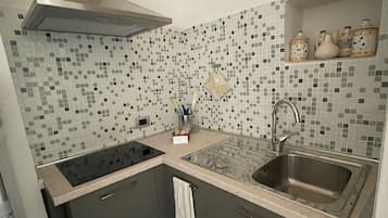 Fridge, stovetop, coffee/tea maker, cookware/dishes/utensils