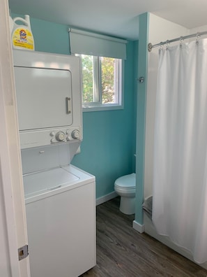 Combined shower/bathtub, hair dryer, towels, soap