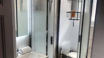Shower, hair dryer, towels, soap