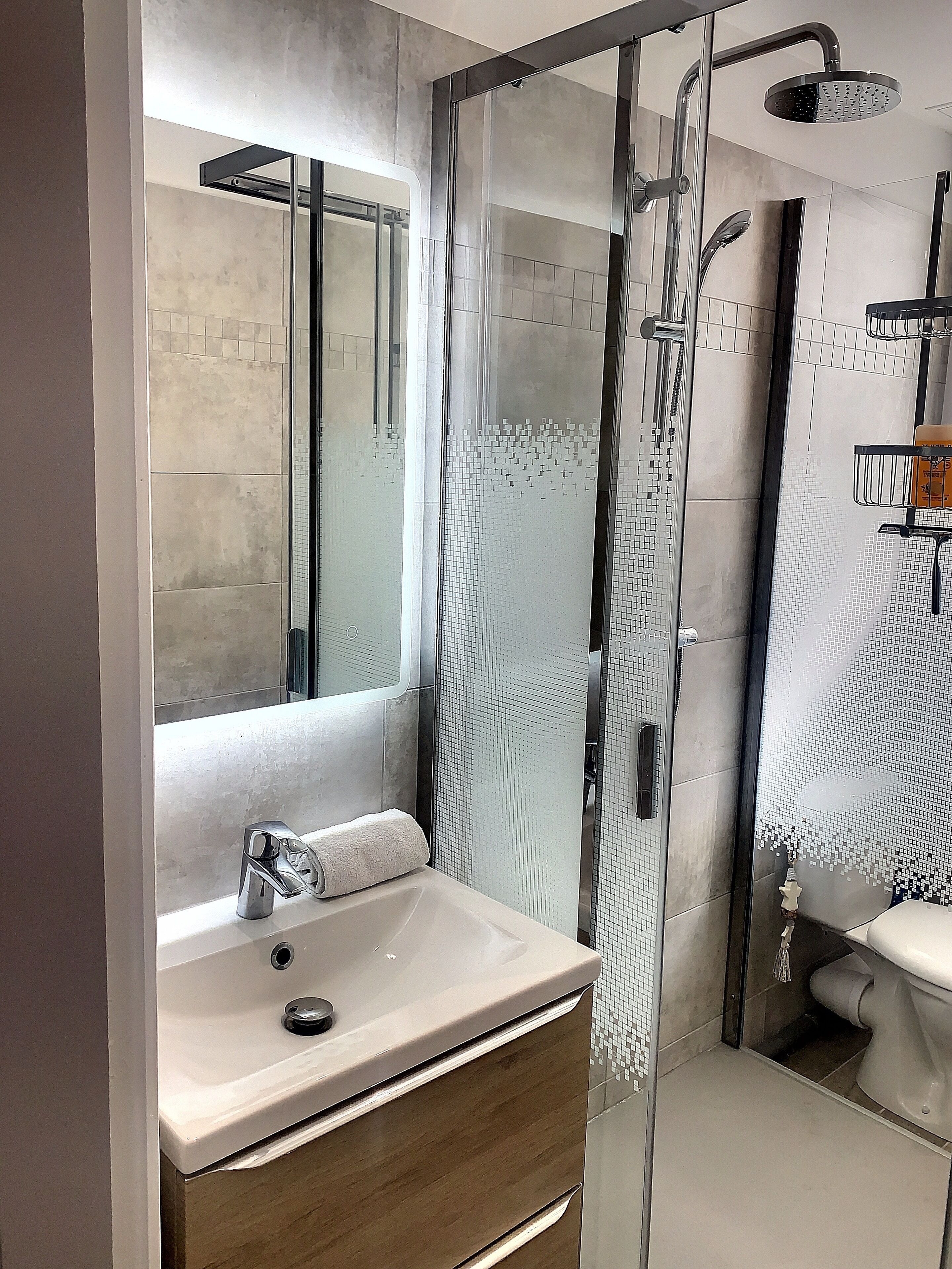 Shower, hair dryer, towels, soap