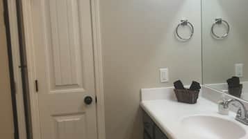 Bathtub, towels, toilet paper