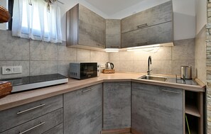 Fridge, stovetop, dishwasher, coffee/tea maker