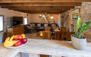 Relax in this inviting living area with a sofa, chairs, and dining table.
