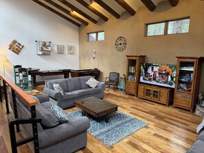 Smart TV, fireplace, table football, books