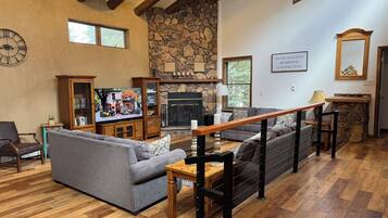 Smart TV, fireplace, table football, books