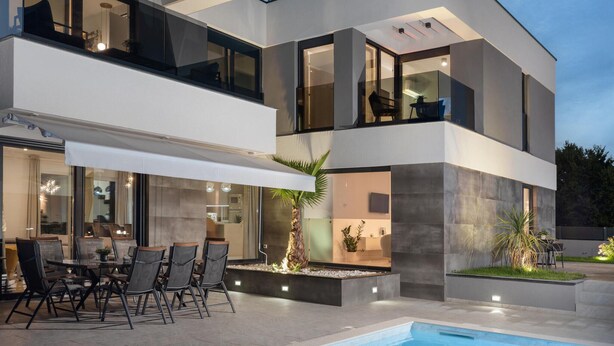 A modern two-story house with a pool, outdoor seating, and large windows. - Awesome home in Zaton (Zaton)