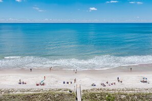 On the beach, sun loungers, beach towels