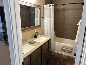 Combined shower/tub, hair dryer, towels, soap