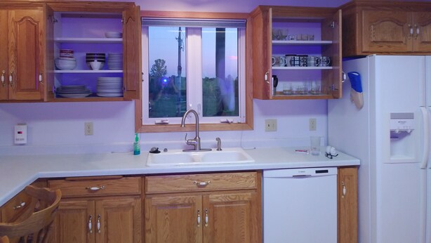 A kitchen with wooden cabinets, a white sink, and a Bosch dishwasher. - Quiet, remotely located in the country. (Eden Valley)